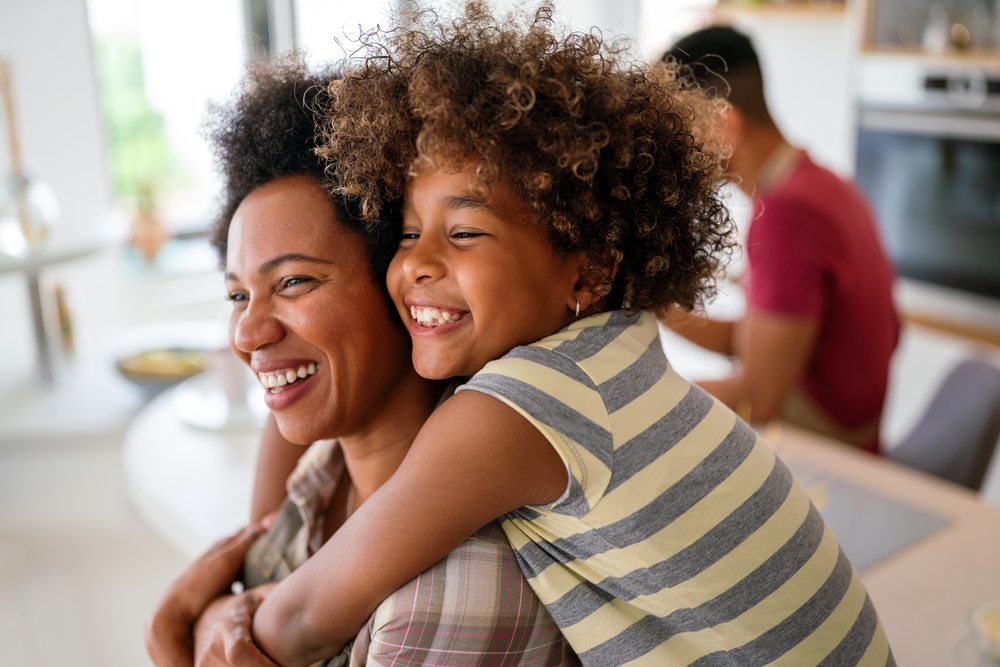 Smiling mother and child enjoy brighter smiles made possible by Payment Plans at Craft Dental