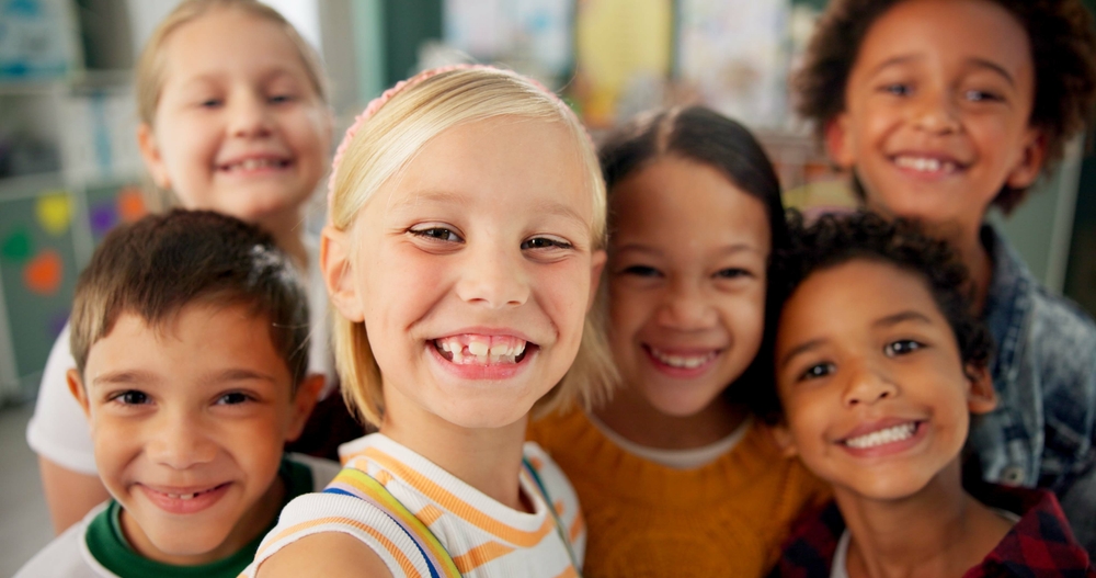 Group of smiling children showing healthy teeth after Pediatric Dentistry care at Craft Dental